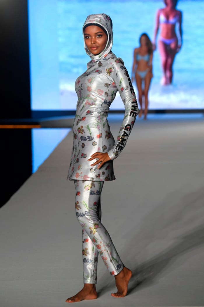 Halima Aden walks the runway during the 2019 Sports Illustrated Swimsuit Runway Show During Miami Swim Week At W South Beach - Runway at WET poolside lounge at W South Beach on July 14, 2019 in Miami Beach, Florida